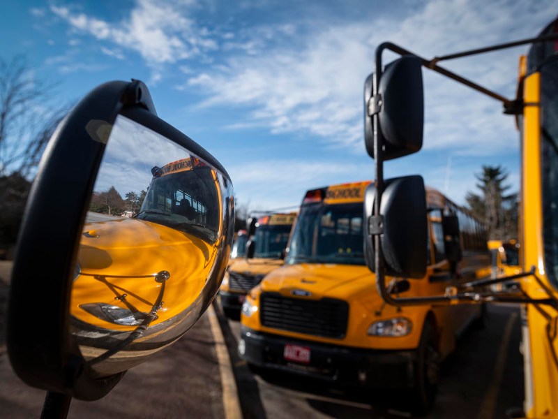 A yellow school bus parked in a parking lot.